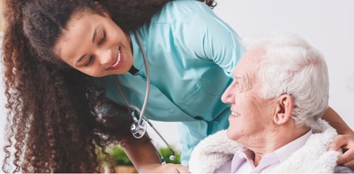 Female Home Health Nurse Smiling at Patient